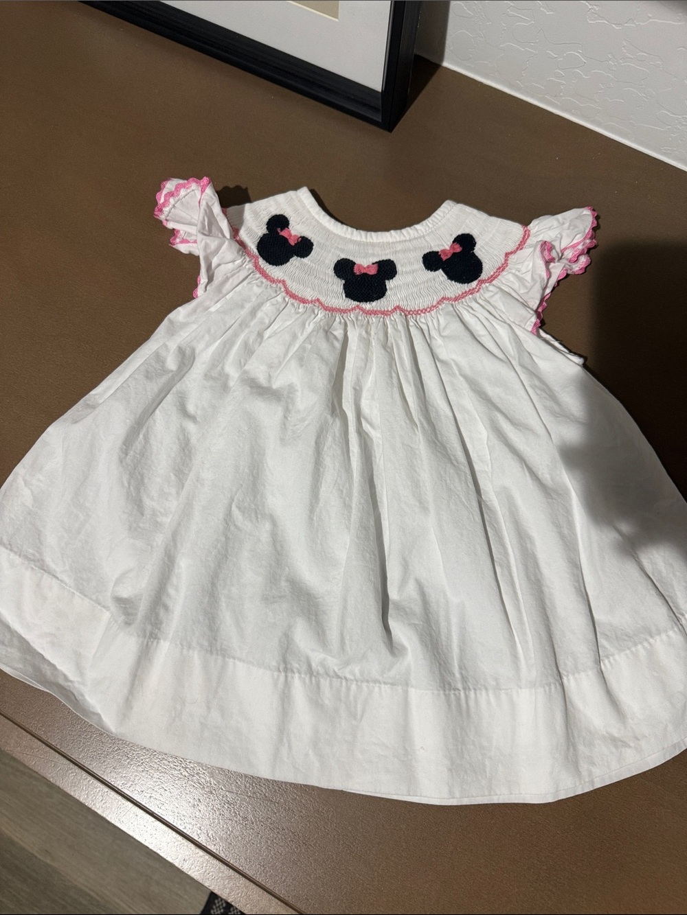 Smockingbird White Smocked Girls' Dress with Minnie Mouse Motifs and Pink Trim